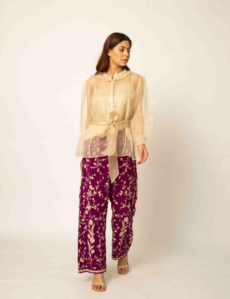 The indo-western Beige colored jacket with purple pants