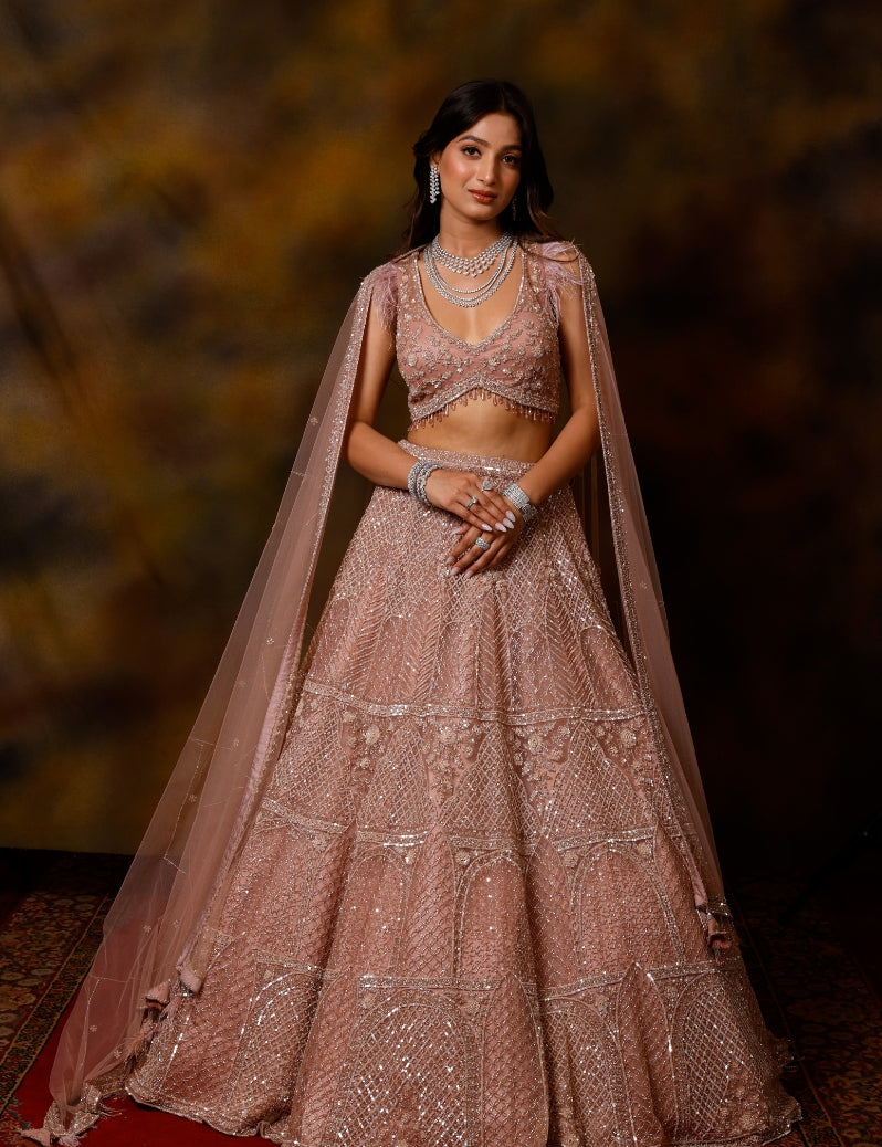 THE CONSTANT CORAL LEHENGA SET WITH HAND EMBROIDERY OF CUTDANA SEQUENCE