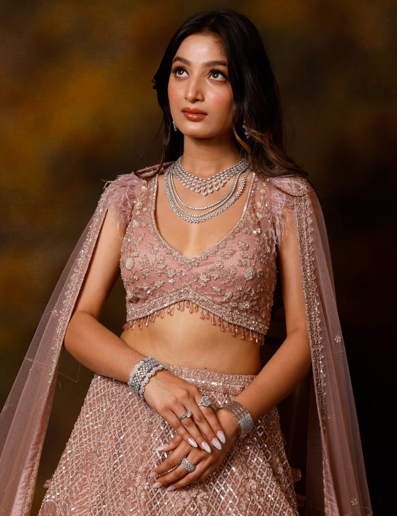 THE CONSTANT CORAL LEHENGA SET WITH HAND EMBROIDERY OF CUTDANA SEQUENCE