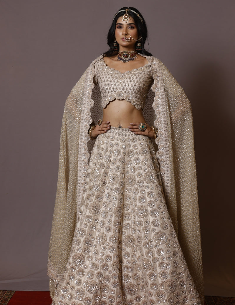 THE IVORY COLOR LEHENGA SET WITH ALLOVER HAND EMBROIDERY OF CUTDANA SEQUENCE