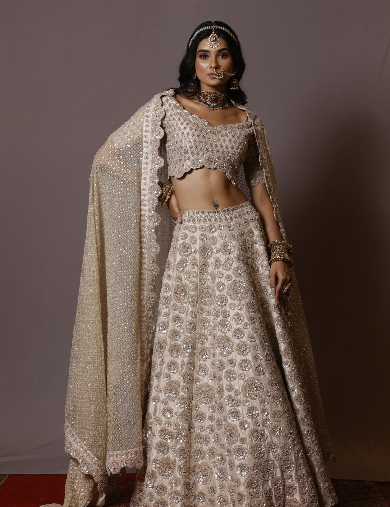 THE IVORY COLOR LEHENGA SET WITH ALLOVER HAND EMBROIDERY OF CUTDANA SEQUENCE